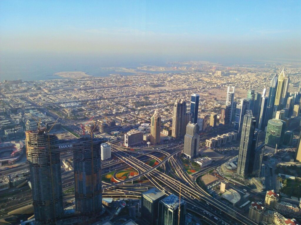 Stunning view of Dubai skyline featuring Burj Khalifa and modern high-rise buildings, perfect backdrop for luxury holiday homes in the UAE.