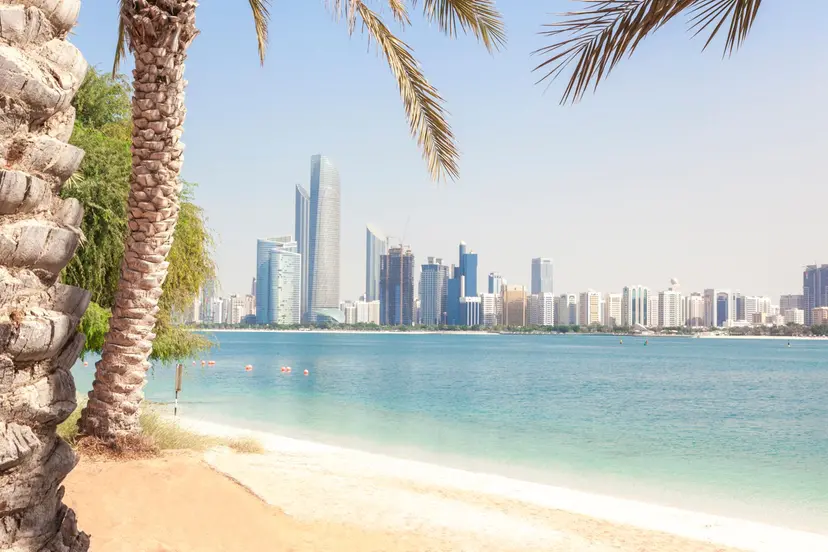 The Corniche Abu Dhabi waterfront with walking track and beach view.
