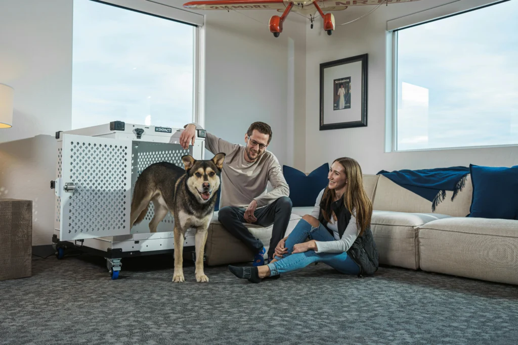 Family relaxing with pet in cozy holiday home living room