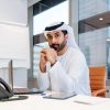 Middle-eastern businessman wearing traditional arab kandura working in the office in Dubai – Adult arabian business man working in the UAE Middle-eastern businessman wearing traditional arab kandura working in the office in Dubai - Adult arabian business man working in the UAE